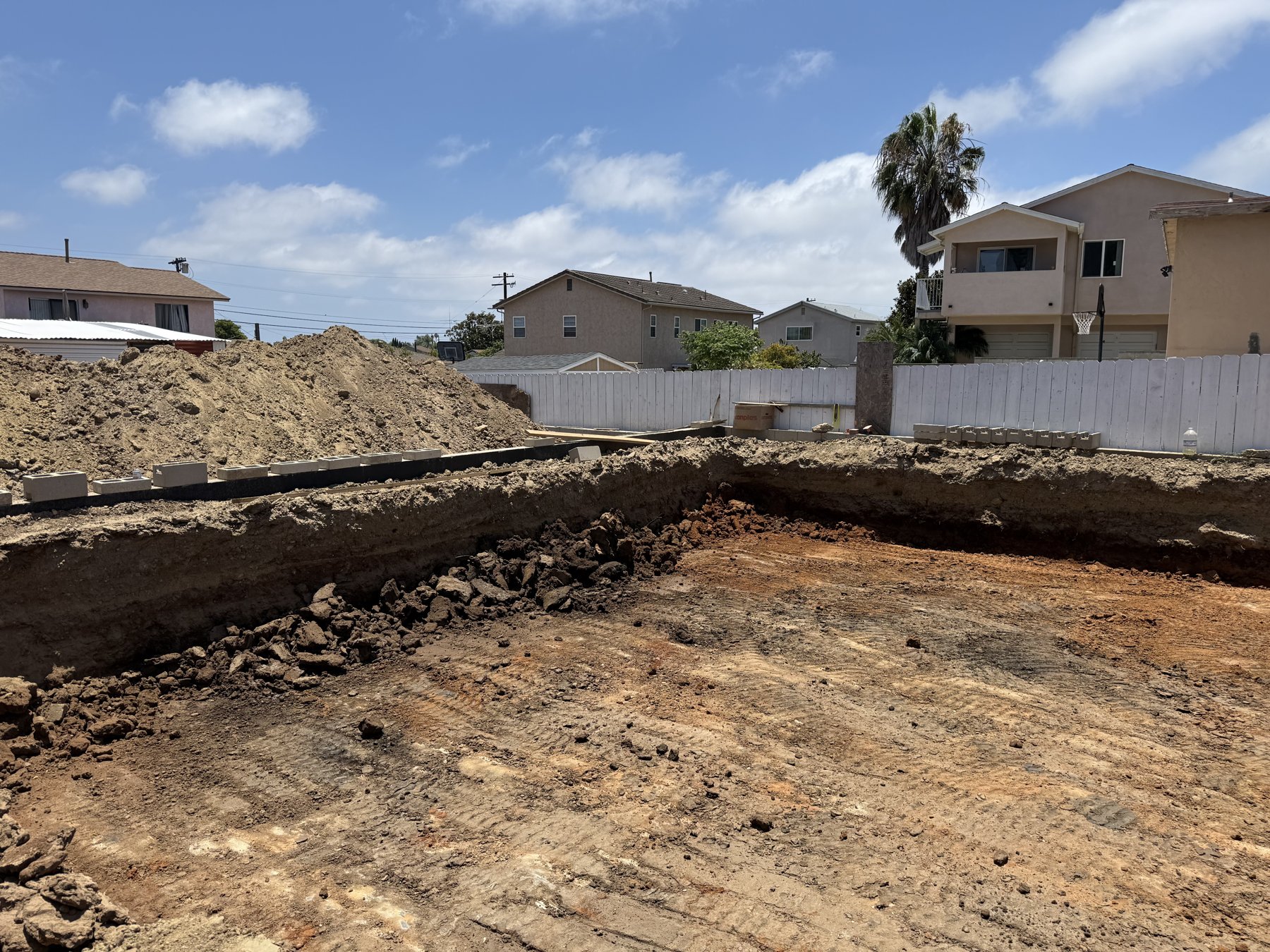 Excavated site showing exposed soil layers and earthwork